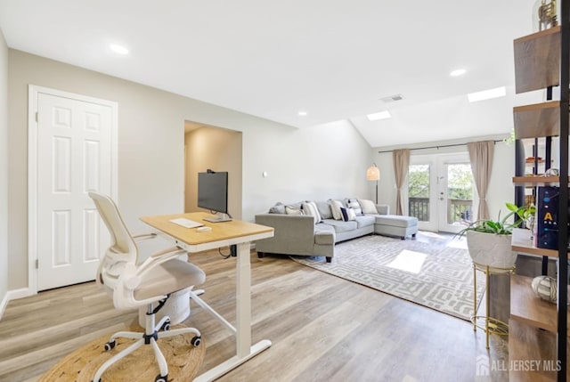 living area featuring recessed lighting, visible vents, light wood-style flooring, and lofted ceiling