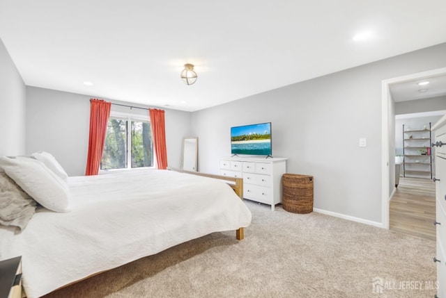 carpeted bedroom with recessed lighting and baseboards
