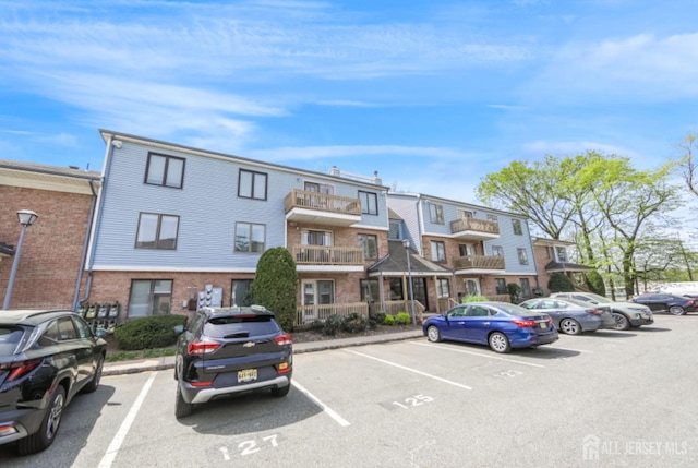view of property with uncovered parking