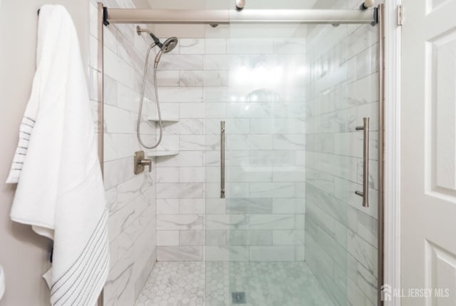 bathroom with a shower stall