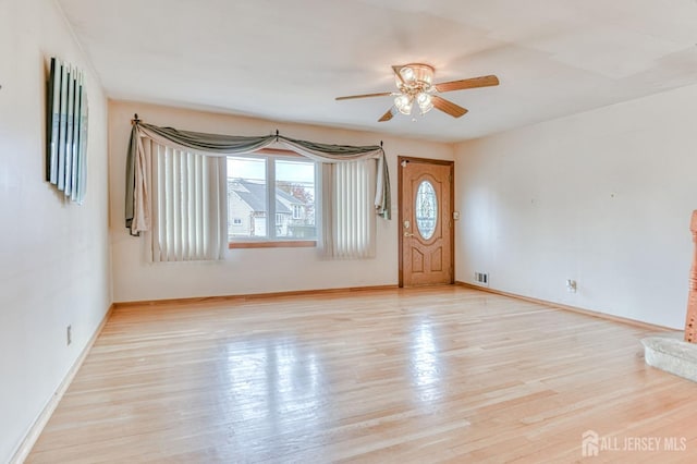 14 Bradford Rd, East Brunswick, NJ 08816 - foyer featuring ceiling fan, light wood finished floors, and baseboards