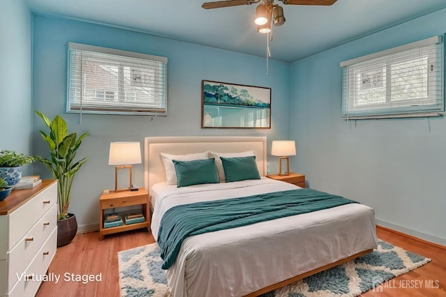14 Bradford Rd, East Brunswick, NJ 08816 - bedroom featuring multiple windows, light wood-type flooring, baseboards, and ceiling fan