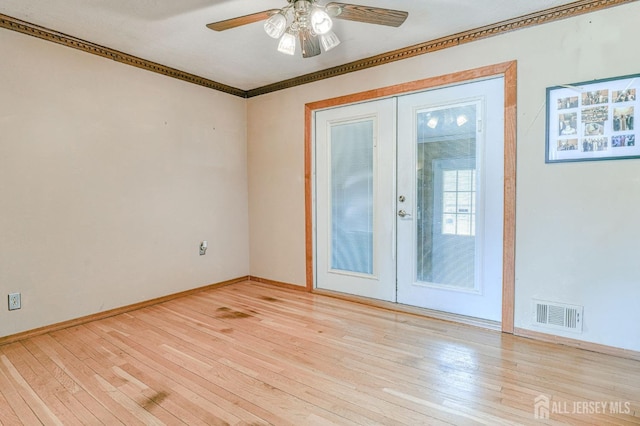 14 Bradford Rd, East Brunswick, NJ 08816 - spare room with light wood finished floors, ceiling fan, crown molding, and baseboards