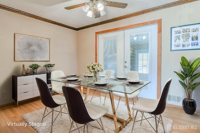 14 Bradford Rd, East Brunswick, NJ 08816 - dining space with light wood finished floors, ceiling fan, and ornamental molding