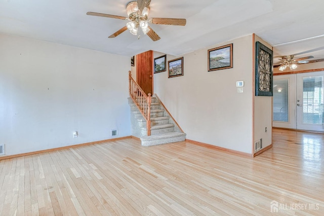 14 Bradford Rd, East Brunswick, NJ 08816 - empty room featuring ceiling fan, wood-type flooring, stairway, and baseboards