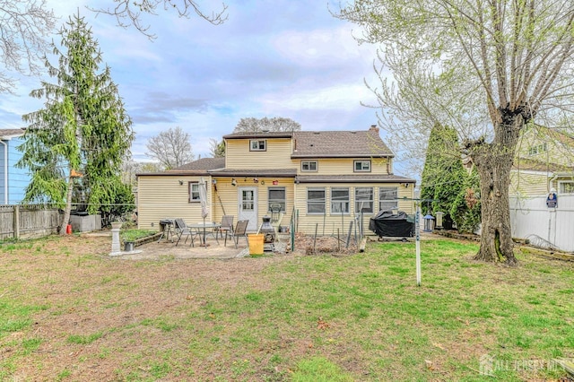 14 Bradford Rd, East Brunswick, NJ 08816 - back of house featuring a patio, a chimney, and a shingled roof