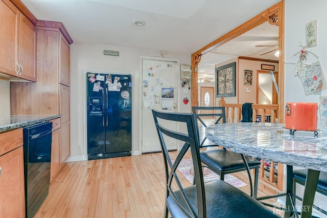 14 Bradford Rd, East Brunswick, NJ 08816 - kitchen with black appliances, a ceiling fan, light wood-style flooring, stone countertops, and brown cabinets
