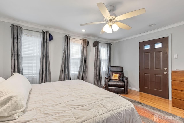bedroom featuring ornamental molding, wood finished floors, baseboards, recessed lighting, and a ceiling fan
