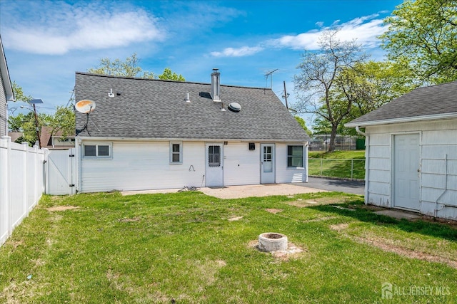 137 Grand Ave, Iselin, NJ 08830 - rear view of property featuring a gate, a patio area, roof with shingles, and a fire pit