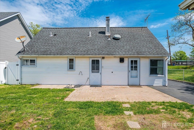 137 Grand Ave, Iselin, NJ 08830 - rear view of house featuring roof with shingles, a gate, and a patio