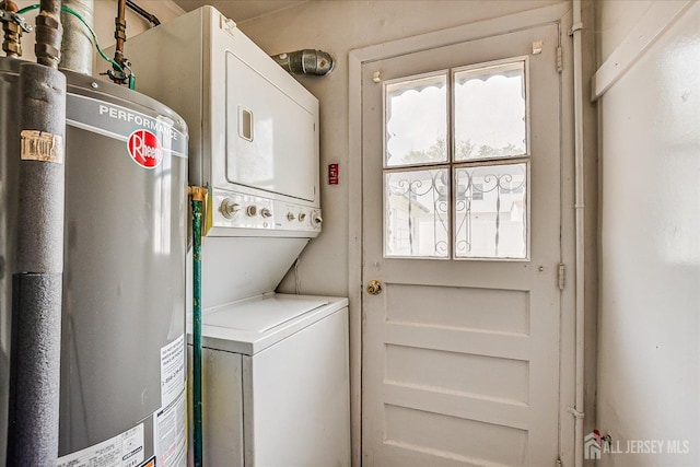 137 Grand Ave, Iselin, NJ 08830 - washroom featuring estacked washer and dryer, gas water heater, and healthy amount of natural light