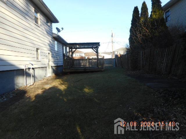 view of yard featuring a pergola and a wooden deck