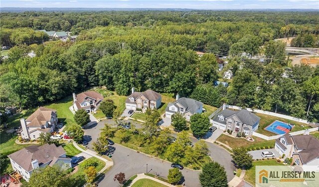 aerial view featuring a residential view and a forest view