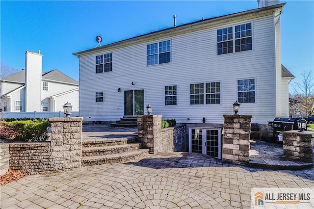 back of property featuring a patio area