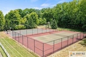 view of tennis court with fence