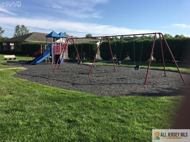 community playground featuring a yard