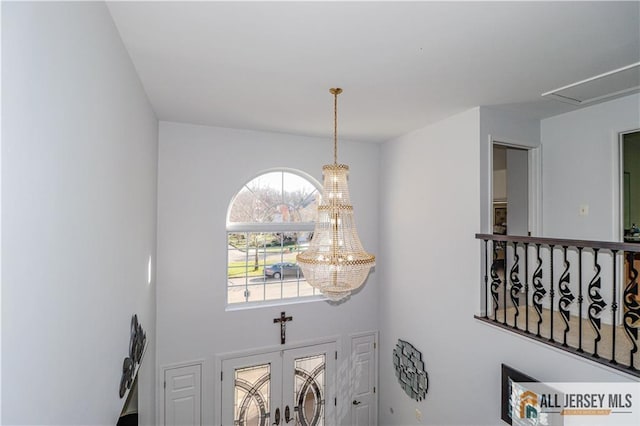 foyer featuring a chandelier
