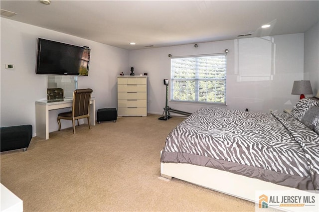 carpeted bedroom with recessed lighting and visible vents