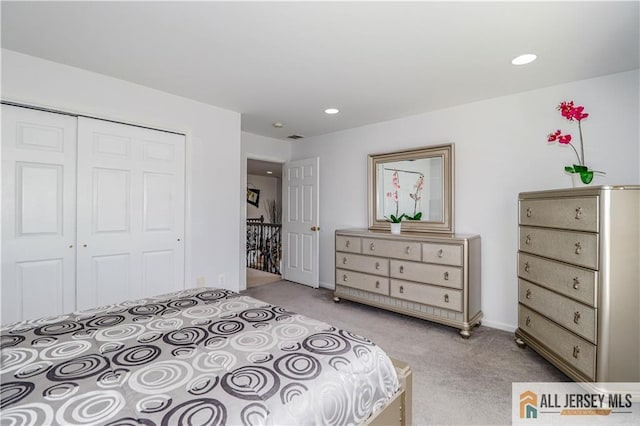 bedroom with recessed lighting, a closet, baseboards, and light carpet