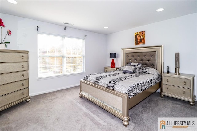 carpeted bedroom featuring recessed lighting, visible vents, and baseboards