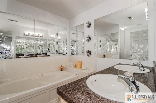 bathroom with a bath, walk in shower, a sink, and visible vents