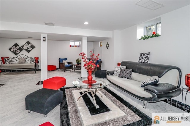 living area featuring recessed lighting and visible vents
