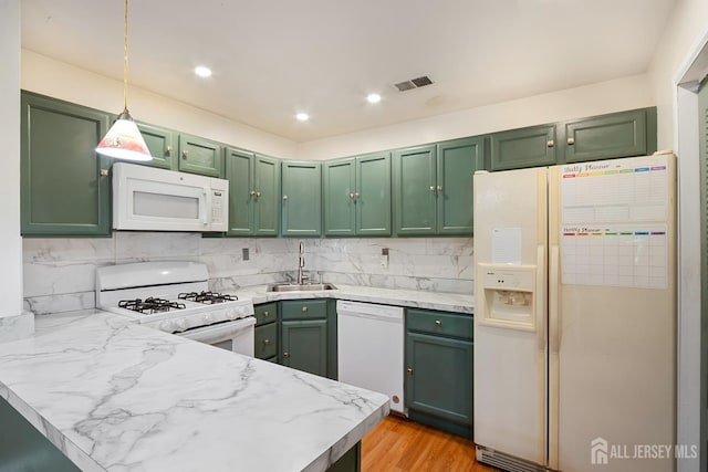 224 Pennsylvania Way N, Brunswick, NJ 08902 - kitchen featuring white appliances, green cabinetry, a peninsula, decorative backsplash, and recessed lighting