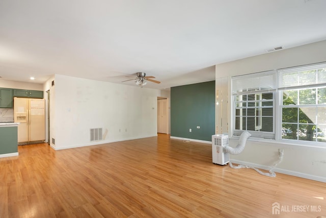 224 Pennsylvania Way N, Brunswick, NJ 08902 - unfurnished living room featuring light wood-style flooring and ceiling fan
