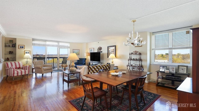 30 S Adelaide Ave Unit 7H, Highland Park, NJ 08904 - dining room with a chandelier, dark wood-type flooring, and a textured ceiling