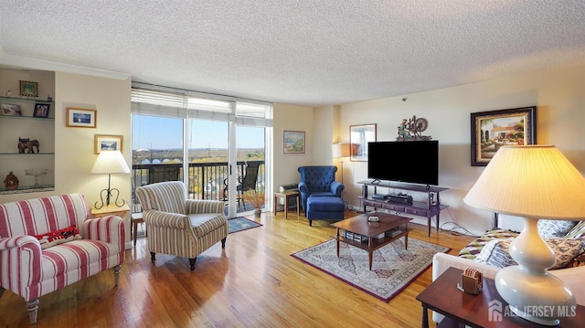 30 S Adelaide Ave Unit 7H, Highland Park, NJ 08904 - living room with a textured ceiling and wood finished floors