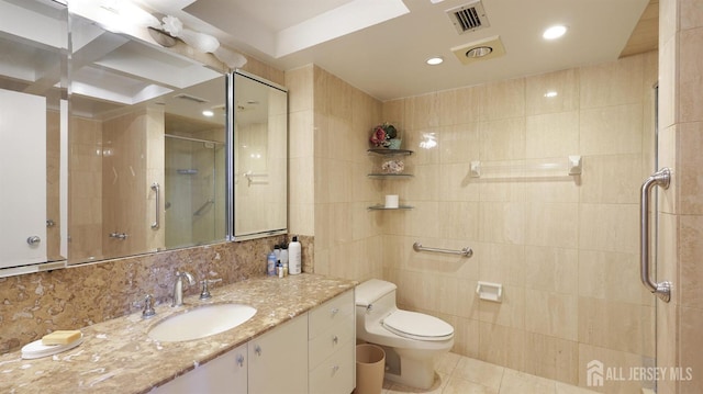 30 S Adelaide Ave Unit 7H, Highland Park, NJ 08904 - bathroom featuring a stall shower, vanity, tile walls, tile patterned floors, and backsplash