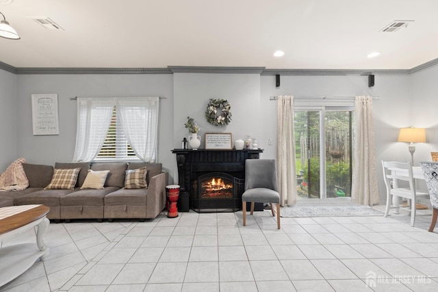 265 Plum Dr, Marlboro, NJ 07746 - living area featuring crown molding, a lit fireplace, recessed lighting, and light tile patterned flooring