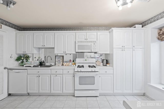 265 Plum Dr, Marlboro, NJ 07746 - kitchen featuring white appliances, white cabinetry, light countertops, and light tile patterned flooring