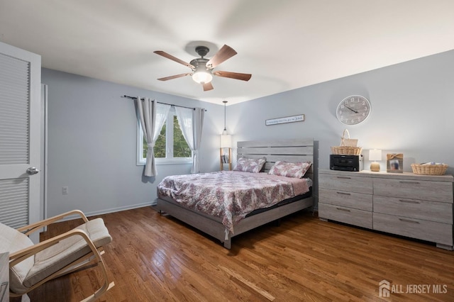 265 Plum Dr, Marlboro, NJ 07746 - bedroom with wood finished floors and a ceiling fan
