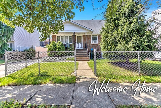 bungalow featuring a front yard and a porch