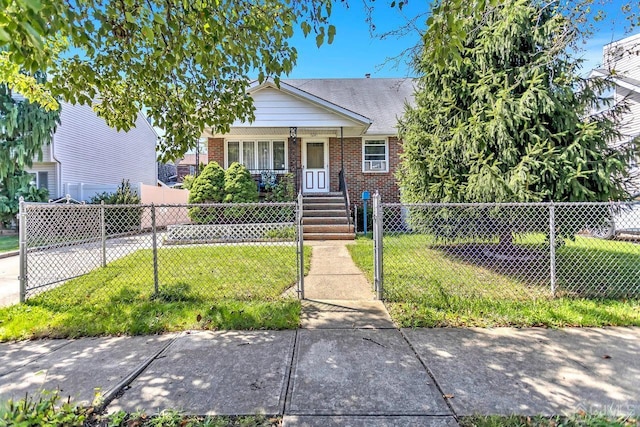 bungalow-style home featuring covered porch and a front lawn