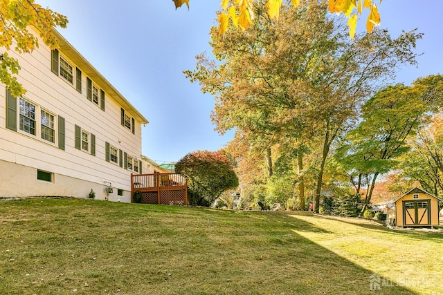 view of yard with a shed and a deck