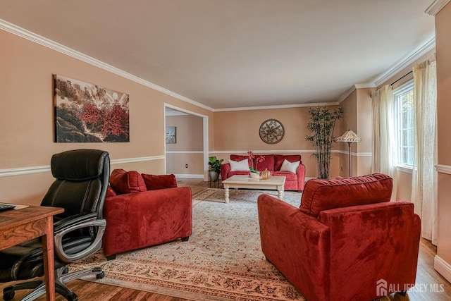 living room with crown molding and hardwood / wood-style floors