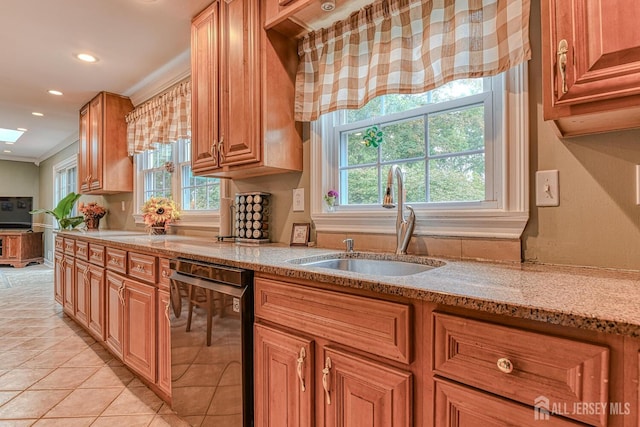 kitchen featuring sink, stainless steel dishwasher, light stone countertops, ornamental molding, and plenty of natural light