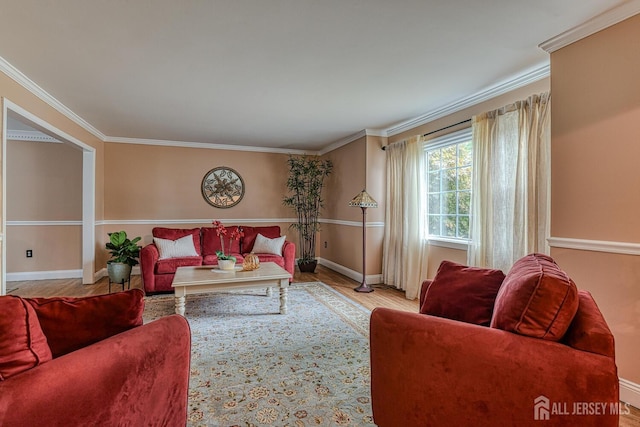 living room with light hardwood / wood-style floors and ornamental molding