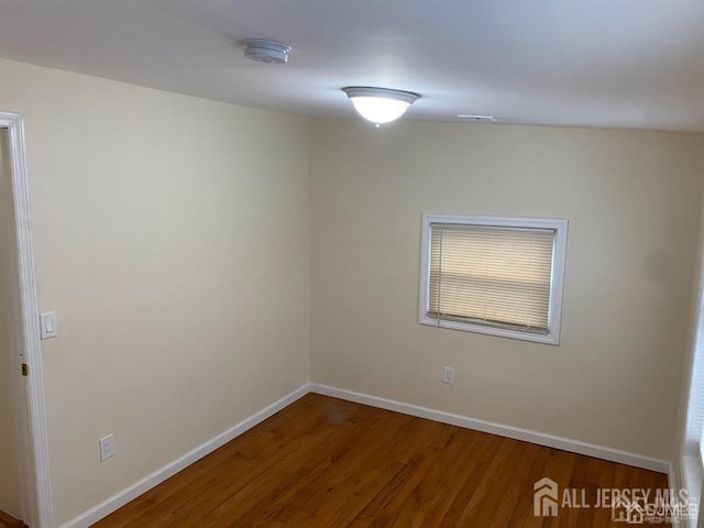 155 2nd St, South Amboy, NJ 08879 - spare room featuring a smoke detector and wood finished floors