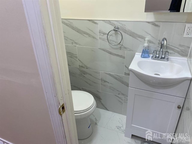155 2nd St, South Amboy, NJ 08879 - bathroom featuring vanity, marble finish floors, and tile walls