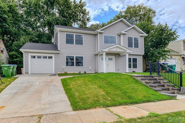 front facade featuring a garage and a front yard