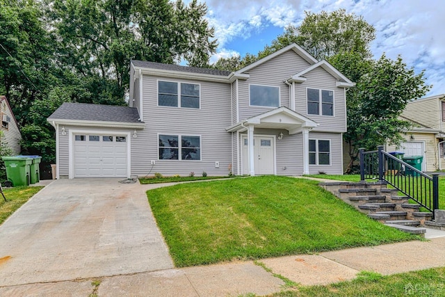 view of front facade featuring a garage, driveway, and a front lawn