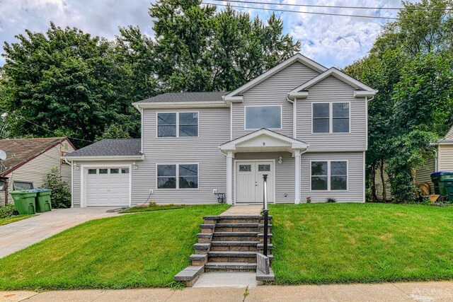 view of front facade with a garage and a front yard