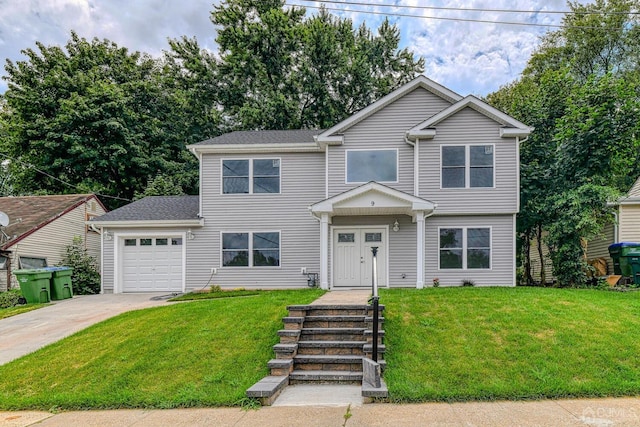 view of front of property with driveway, an attached garage, and a front lawn