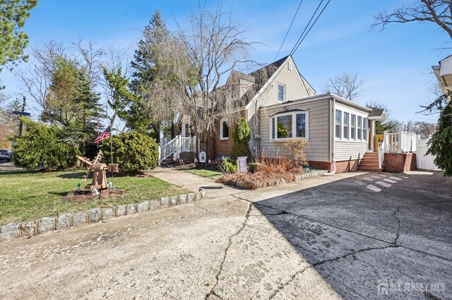 6 Claremont Ave, Colonia, NJ 07067 - view of front of house with a front lawn