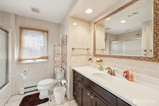 6 Claremont Ave, Colonia, NJ 07067 - full bathroom with tile walls, baseboard heating, toilet, vanity, and tile patterned floors