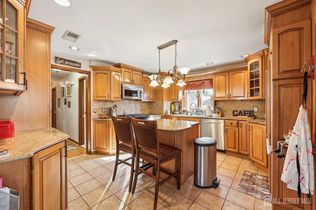 6 Claremont Ave, Colonia, NJ 07067 - kitchen featuring stainless steel appliances, light tile patterned floors, decorative backsplash, and recessed lighting