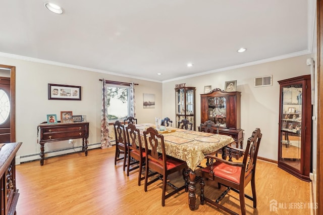6 Claremont Ave, Colonia, NJ 07067 - dining area featuring a baseboard heating unit, recessed lighting, light wood finished floors, ornamental molding, and baseboards